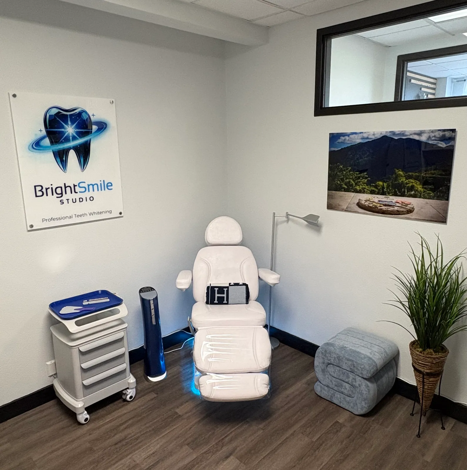 The treatment chair beneath the BrightSmile Studio sign